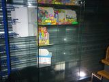 a glass display case in the corner of a store