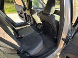 a view of the inside of a car from the driver ' s seat