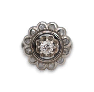 an image of a silver ring with a diamond in the center