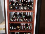 many bottles of wine in a wine rack in a room