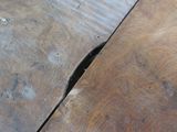 a wooden table with a hole in the middle of it
