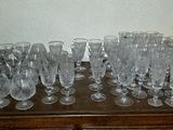 a lot of empty wine glasses sitting on a table