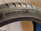 a close up of a tire on a cardboard box with a box in the background