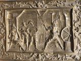 une plaque métallique sur laquelle figure l'image d'un homme et d'une femme