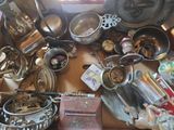 a lot of junk on the table in the room