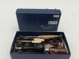 an open blue box with a knife and a knife sharper in it