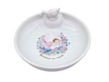 a close up of a small white plate with a bird on it