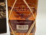 an image of a bottle of whiskey with a box