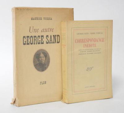 two books sitting on top of each other on a white surface