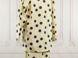 an image of a polka dot print dress and jacket on a mannequin stand