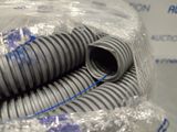 a pile of pipes wrapped in plastic on a table