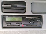 a radio in the center of a car with a clock on it