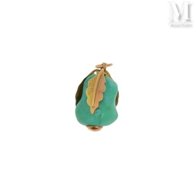une image représentant une bague en or et turquoise ornée d'une feuille