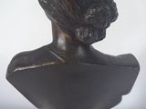 statue of a woman ' s head on a base with a white background