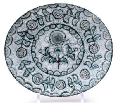 an image of a blue and white plate with a design on it