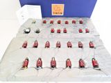 a lot of small red and black toys on a table