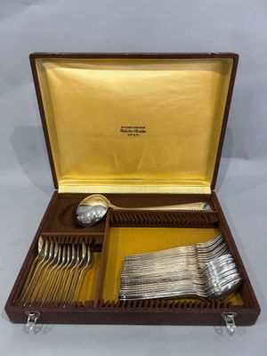 a wooden box with silverware in it on a white surface