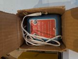 a box that has a charger and a cord in it