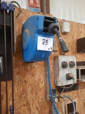 a picture of a garage with a lot of tools on the wall