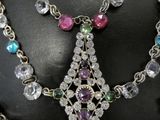 a necklace that has a bunch of different colored beads on it