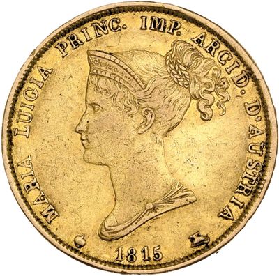 a close up of a gold coin with a woman ' s head on it