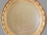 a gold plate with an eagle on top of it