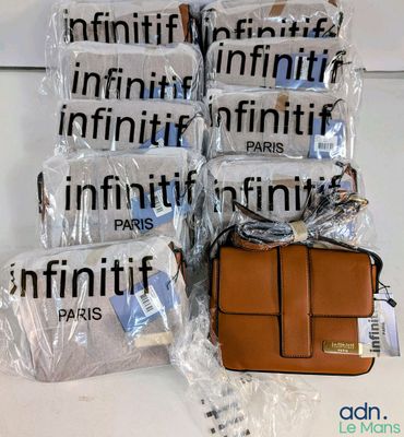 many bags of luggage sitting on a table next to each other