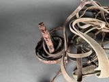 a pile of old rusty objects on a table