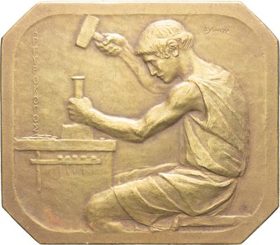 une image représentant une médaille d'or sur laquelle figure un homme tenant un marteau à la main