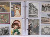 an open book with pictures of people and animals on it
