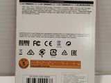the back of a white box with a black and orange label on it