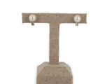 pearl and burlock t - shaped earrings on a burlock stand