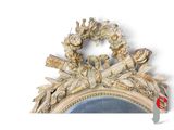 an image of a mirror with a wreath on it