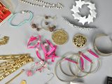many different types of jewelry on the table