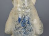a white and blue vase with a bear on it