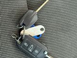 a car key that is attached to the back seat of a car