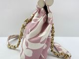pink and white floral purse with gold chain strap