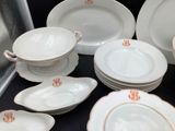 a lot of plates and bowls that are on the table