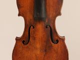 an old violin with a bow on a white background