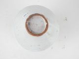 a white bowl with a brown rim on a white table