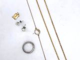 a collection of jewellery including a necklace, bracelet, and ring