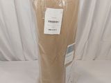 a bag of brown paper sitting on a white table