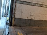 a truck that is sitting in the back of it ' s truck