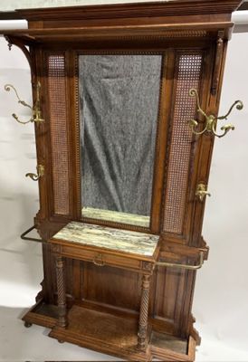 a wooden cabinet with a mirror on top of it