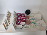 a white shelf with a lot of different items on it