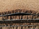 a close up of a pile of brown carpeting on top of a table