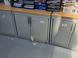 a desk with a bunch of files on top of it