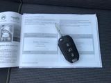 a car key sitting on top of an open book