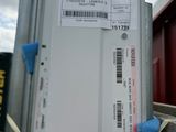 a box with a ticket attached to it and a blue glove on it