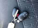 a car key with a keychain and a key chain attached to it